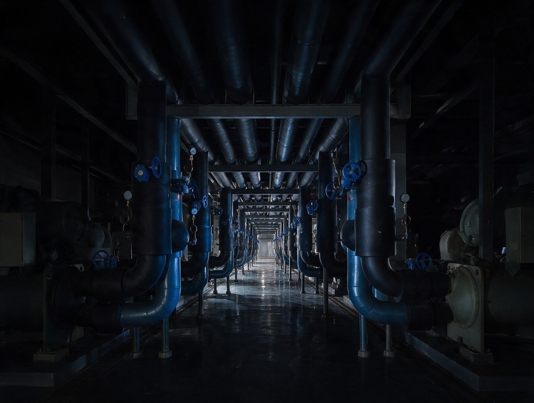 Chillers and chilled-water pipework in a mechanical plant room